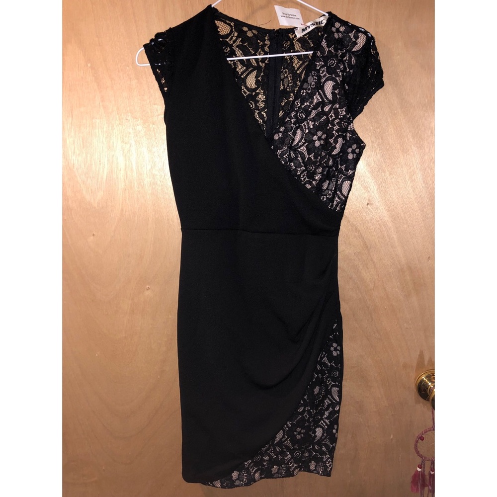 Black form fitting lace dress.
